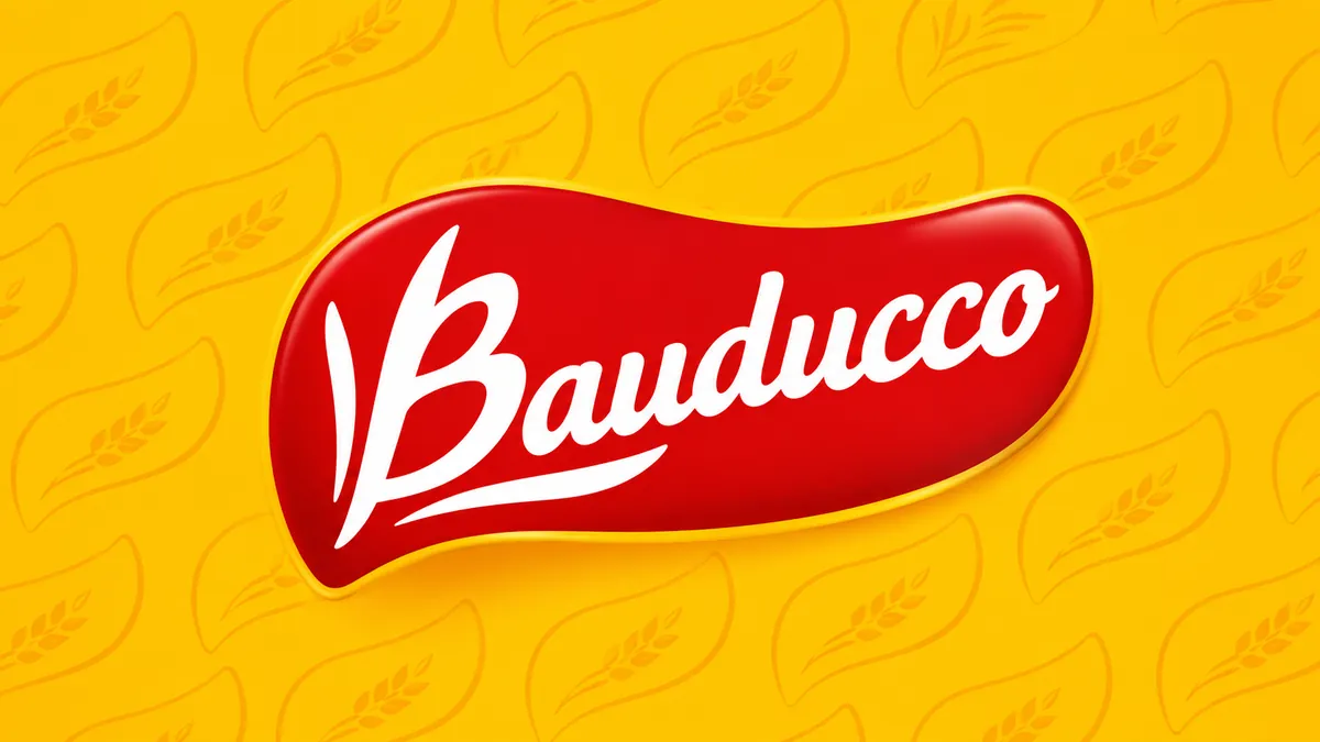 Identidade visual amarela, vermelha e branca da Bauducco